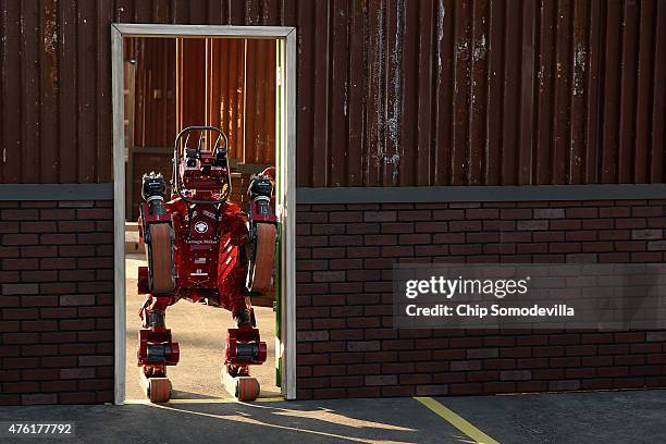 Team Tartan Rescue's CHIMP robot competes in the Defense Advanced Research Projects Agency Robotics Challenge at the Fairplex June 6, 2015 in Pomona,...