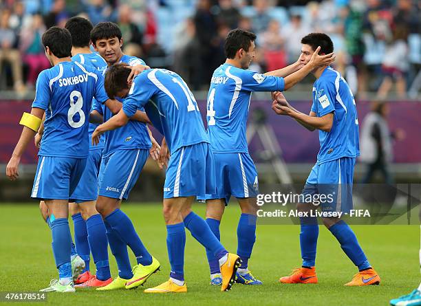 Mirijamol Kosimov of Uzbekistan celebrates with Zabikhillo Urinboev after scoring the third goal during the FIFA U-20 World Cup Group F match between...