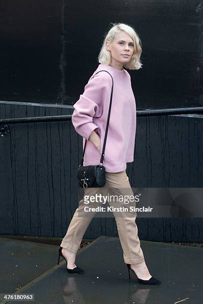 Photographer Jessie Bush wears a Studio Nicholson top, Carly Hunter trousers, Givenchy bag, Alexandre Birman shoes on day 5 of London Collections:...