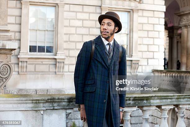 Milliner Latouche wears Debenhams jacket, Lacoste shirt and vintage tie on day 5 of London Collections: Women on February 18, 2014 in London, England.