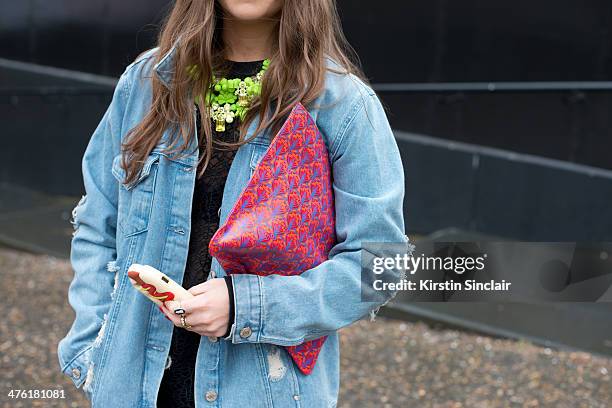 Senior Press Officer Sophie Pate wears a Topshop jacket, Liberty bag, Monki top, Ek Thongprasert jewellery on day 5 of London Collections: Women on...