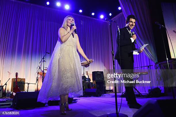 Actress Kristen Bell and host Max Greenfield speak onstage at the 14th annual Chrysalis Butterfly Ball sponsored by Audi, Kayne Anderson, Lauren B....