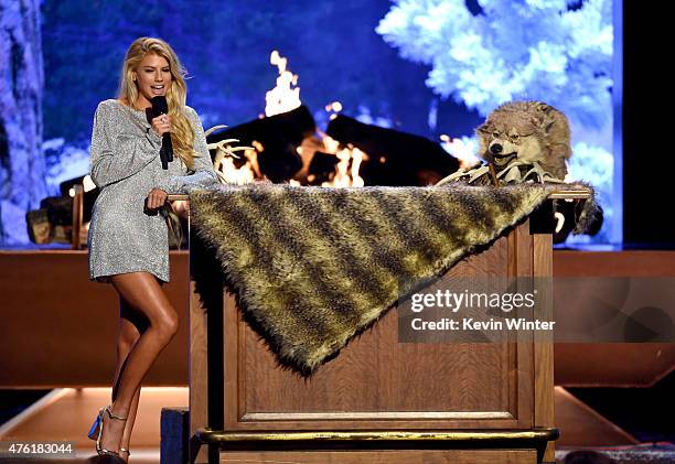 Model Charlotte McKinney and Triumph, the Insult Comic Dog speak onstage during Spike TV's Guys Choice 2015 at Sony Pictures Studios on June 6, 2015...