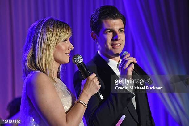 Actress Kristen Bell and host Max Greenfield speak onstage at the 14th annual Chrysalis Butterfly Ball sponsored by Audi, Kayne Anderson, Lauren B....