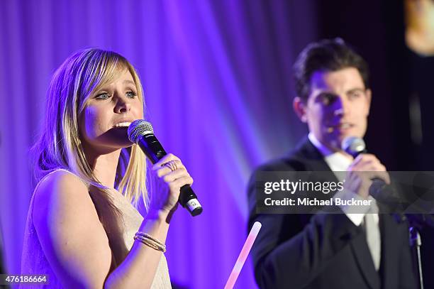 Actress Kristen Bell and host Max Greenfield speak onstage at the 14th annual Chrysalis Butterfly Ball sponsored by Audi, Kayne Anderson, Lauren B....