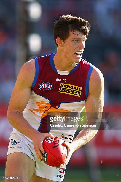 Justin Clarke of the Lions runs the ball during the round 10 AFL match between the Greater Western Sydney Giants and the Brisbane Lions at Spotless...