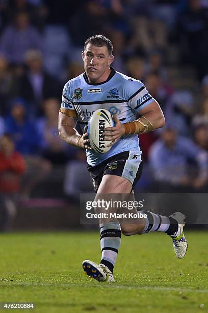 Paul Gallen of the Sharks runs the ball during the round 13 NRL match between the Sharks and the Roosters at Remondis Stadium on June 7, 2015 in...