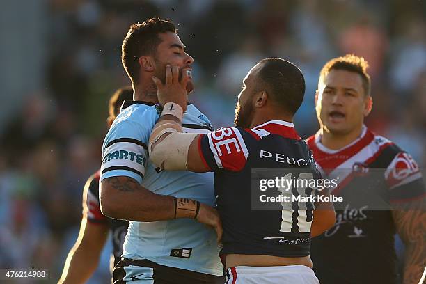 Andrew Fifita of the Sharks is pushed in the faces off against by Sam Moa of the Roosters during the round 13 NRL match between the Sharks and the...