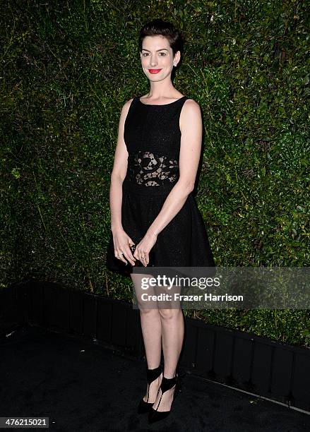 Actress Anne Hathaway attends the Chanel and Charles Finch Pre-Oscar Dinner at Madeo Restaurant on March 1, 2014 in Los Angeles, California.