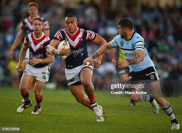 Sio Siua Taukeiaho of the Roosters runs the ball during the round 13 NRL match between the Sharks and the Roosters at Remondis Stadium on June 7,...