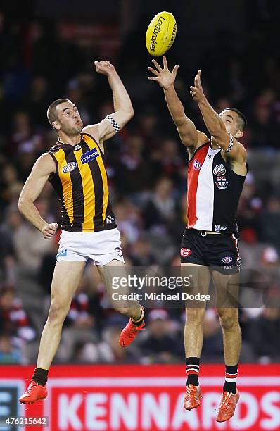 Matt Suckling of the Hawks and Shane Savage of the Saints compete for the ball during the round 10 AFL match between the St Kilda Saints and the...