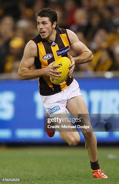 Isaac Smith of the Hawks runs with the ball during the round 10 AFL match between the St Kilda Saints and the Hawthorn Hawks at Etihad Stadium on...
