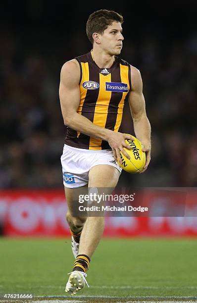 Luke Breust of the Hawks runs with the ball during the round 10 AFL match between the St Kilda Saints and the Hawthorn Hawks at Etihad Stadium on...