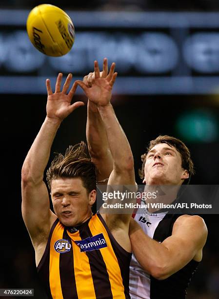 Taylor Duryea of the Hawks and Blake Acres of the Saints compete for the ball during the 2015 AFL round ten match between the St Kilda Saints and the...
