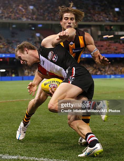 Jimmy Webster of the Saints and Ryan Schoenmakers of the Hawks in action during the 2015 AFL round ten match between the St Kilda Saints and the...