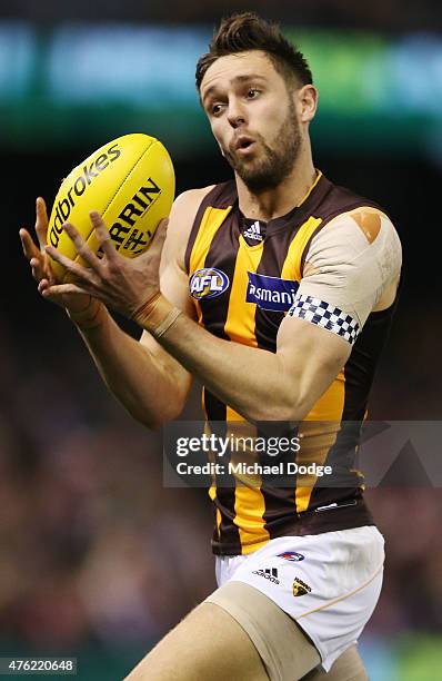 Jack Gunston of the Hawks marks the ball during the round 10 AFL match between the St Kilda Saints and the Hawthorn Hawks at Etihad Stadium on June...