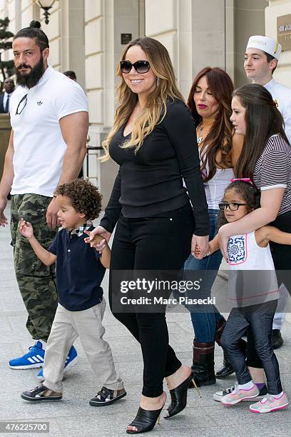 Singer Mariah Carey and her children Moroccan Scott Cannon and Monroe Cannon leave the 'Peninsula' Hotel on June 7, 2015 in Paris, France.