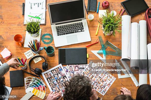 the editor at work choosing the right image - design studio stock pictures, royalty-free photos & images