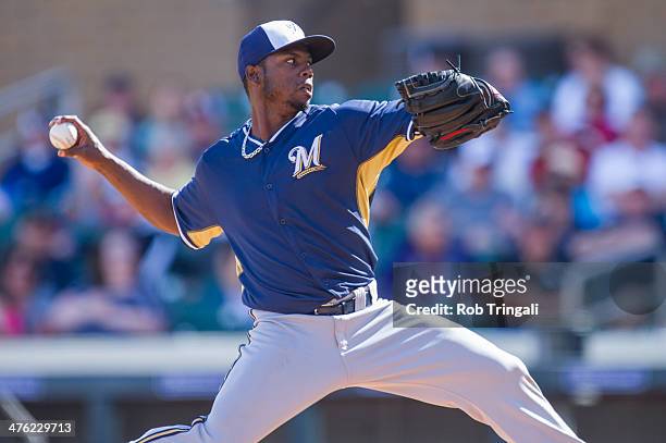 Alfredo Figaro of the Milwaukee Brewers pitches during a spring training game against the Colorado Rockies at Salt River Fields at Talking Stick on...
