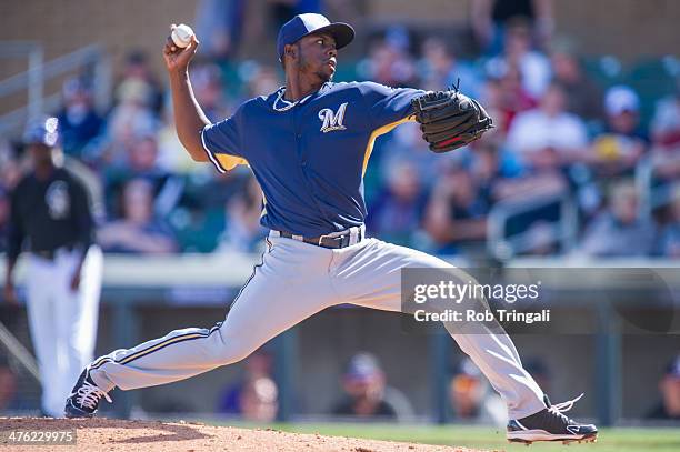 Alfredo Figaro of the Milwaukee Brewers pitches during a spring training game against the Colorado Rockies at Salt River Fields at Talking Stick on...