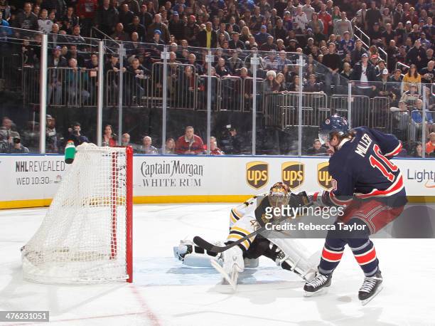 Miller of the New York Rangers scores a goal on Tuukka Rask of the Boston Bruins during the first-period at Madison Square Garden on March 2, 2014 in...