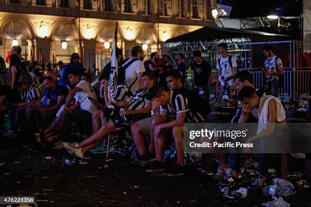 Juventus supporters show their sadness as they leave at the end of the Champions League final soccer match between Juventus and Barcelona in Turin's...