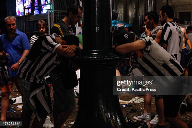 Juventus supporters show their sadness as they leave at the end of the Champions League final soccer match between Juventus and Barcelona in Turin's...