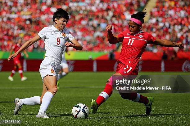 Desiree Scott of Canada defends Wang Shanshan of China PR during the FIFA Women's World Cup Canada 2015 Group A match between Canada and China PR at...
