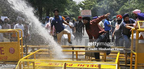 84 Riots Delhi Police disperse Sikh protestors with water cannon as they... News ...