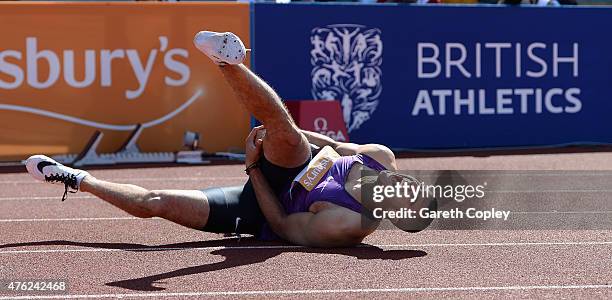 Adam Gemili of Great Britain pulls up with injury during Mens 100 metres during the Sainsbury's Birmingham Grand Prix at Alexander Stadium on June 7,...