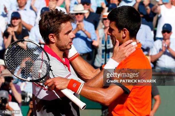 Serbia's Novak Djokovic congratulates Switzerland's Stanislas Wawrinka on winning the men's final match of the Roland Garros 2015 French Tennis Open...