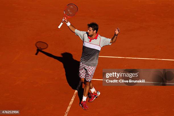 Stanislas Wawrinka of Switzerland celebrates match point in the Men's Singles Final against Novak Djokovic of Serbia on day fifteen of the 2015...