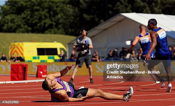 Adam Gemili of Great Britain falls after finishing second in the mens 100m final during the Sainsbury's Birmingham Grand Prix Diamond League event at...