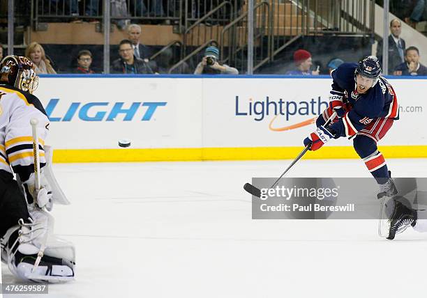Brad Richards of the New York Rangers shoots the puck past goalie Tuukka Rask of the Boston Bruins for a goal in the second period of an NHL hockey...