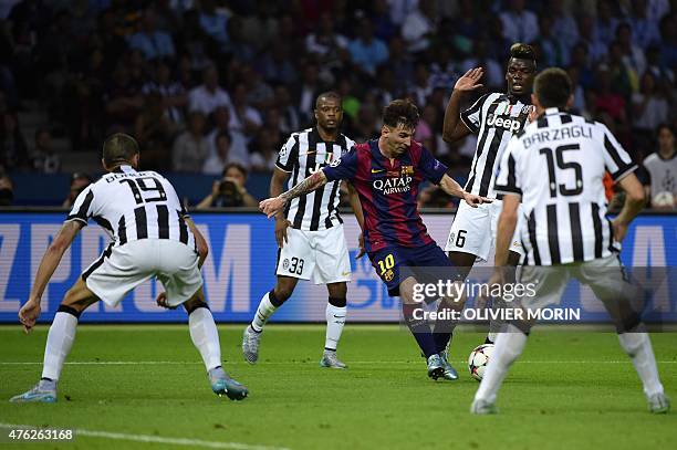 Barcelona's Argentinian forward Lionel Messi controls the ball surrounded by Juventus players during the UEFA Champions League Final football match...