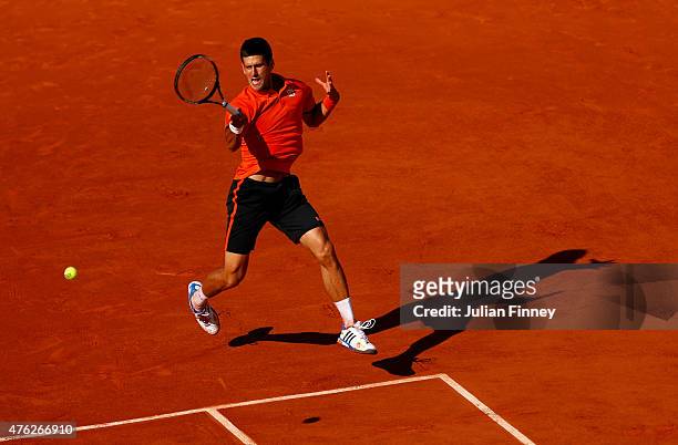 Novak Djokovic of Serbia returns a shot in the Men's Singles Final against Stanislas Wawrinka of Switzerland on day fifteen of the 2015 French Open...