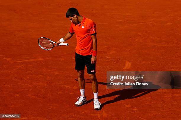 Novak Djokovic of Serbia reacts in the Men's Singles Final against Stanislas Wawrinka of Switzerland on day fifteen of the 2015 French Open at Roland...