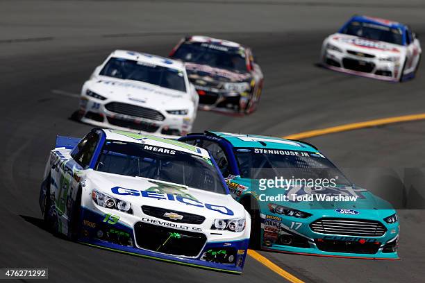 Ricky Stenhouse Jr., driver of the Zest Ford, spins on track during the NASCAR Sprint Cup Series Axalta 'We Paint Winners' 400 at Pocono Raceway on...