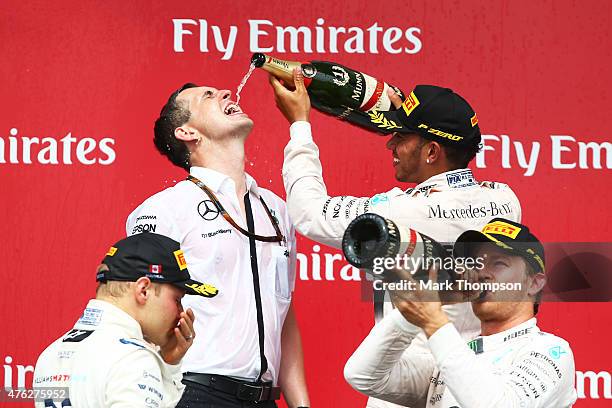 Race winner Lewis Hamilton of Great Britain and Mercedes GP celebrates on the podium during the Canadian Formula One Grand Prix at Circuit Gilles...