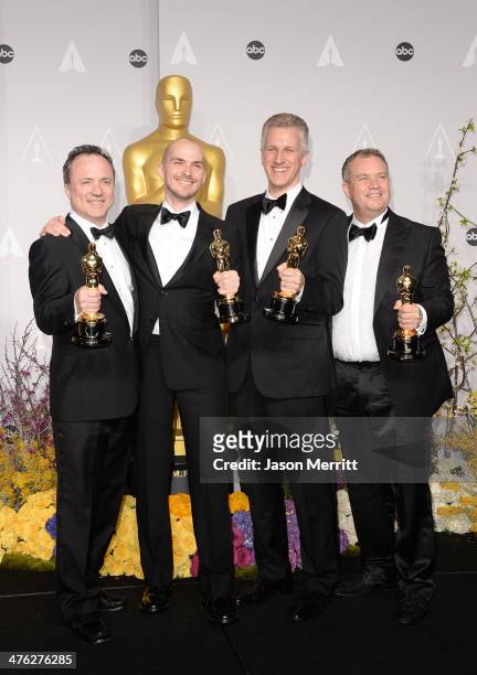 Visual effects artists Timothy Webber, Neil Corbould, Chris Lawrence, and David Shirk, winners of Best Achievement in Visual Effects pose in the...