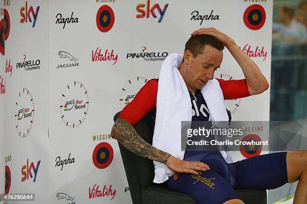 Sir Bradley Wiggins of Great Britain and Team Wiggins recovers after breaking the UCI One Hour Record at Lee Valley Velopark Velodrome on June 7,...