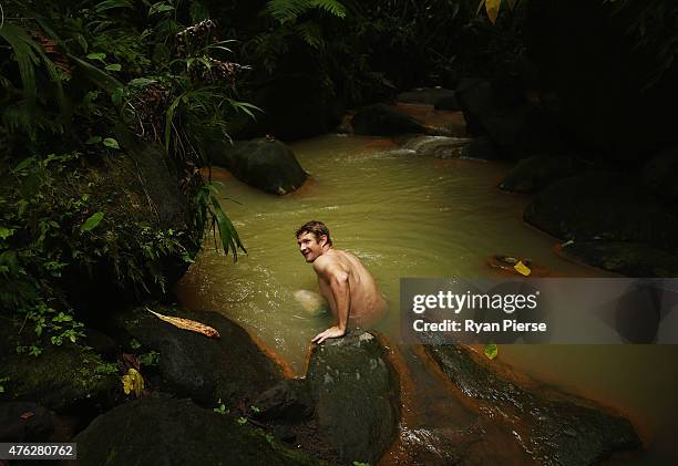 Shane Watson of Australia swims in the hot springs during the Australian Cricket Team's visit to Trafalgar Falls on June 7, 2015 in Roseau, Dominica.