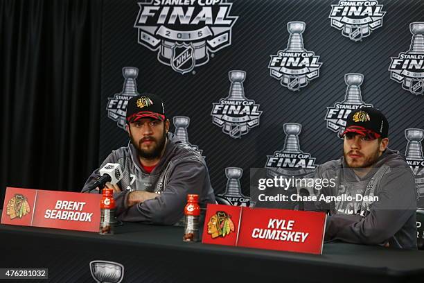 Brent Seabrook and Kyle Cumiskey of the Chicago Blackhawks speak during a press conference for the 2015 NHL Stanley Cup Final at the United Center on...