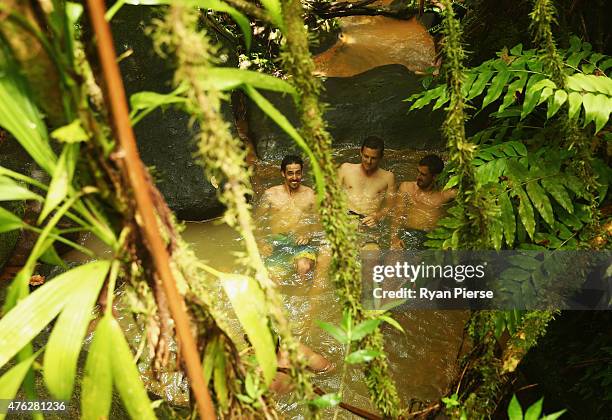 Mitchell Johnson, Josh Hazlewood and Mitchell Starc of Australia swim in the hot springs during the Australian Cricket Team's visit to Trafalgar...