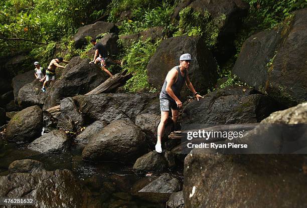 Peter Siddle of Australia climbs up to Trafalgar Falls during the Australian Cricket Team's visit to Trafalgar Falls on June 7, 2015 in Roseau,...