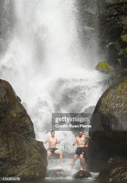 Mitch Marsh and Peter Siddle of Australia swim in Trafalgar Falls during the Australian Cricket Team's visit to Trafalgar Falls on June 7, 2015 in...