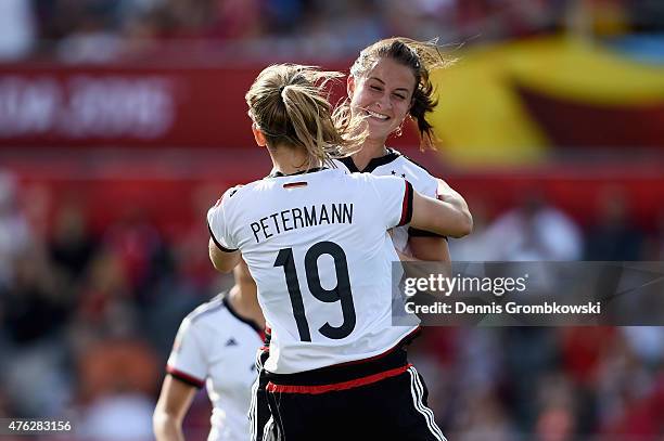 Sara Daebritz of Germany celebrates with team mate Lena Petermann as she scores the eighth goal during the FIFA Women's World Cup Canada 2015 Group B...
