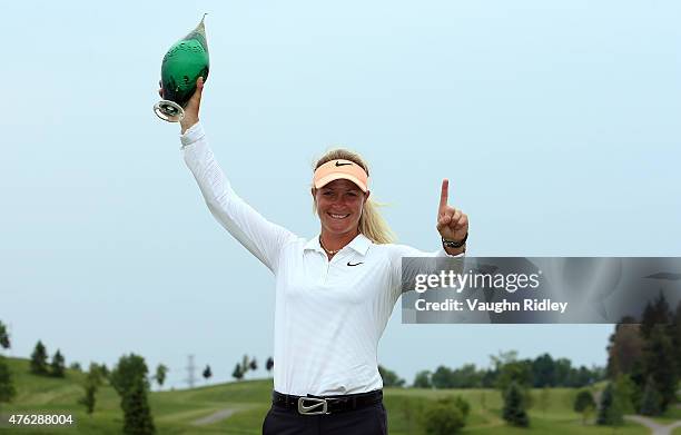 Suzann Pettersen of Norway celebrates with the champions trophy after winning the Manulife LPGA Classic at the Whistle Bear Golf Club on June 7, 2015...