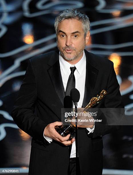 Director Alfonso Cuaron accepts the Best Achievement in Directing award for 'Gravity' onstage during the Oscars at the Dolby Theatre on March 2, 2014...