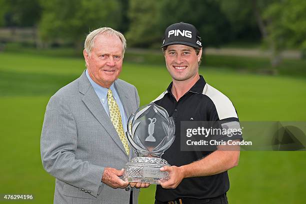 Tournament host Jack Nicklaus and David Lingmerth of Sweden pose with the tournament trophy after Lingmerth wins the Memorial Tournament presented by...